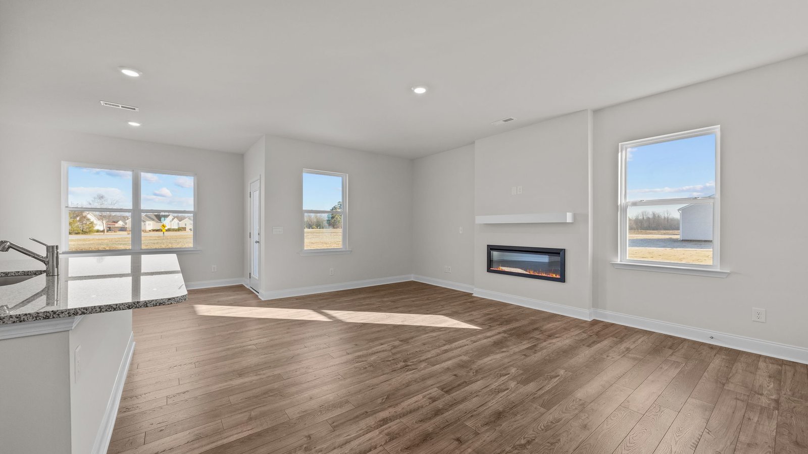 living area with electric fireplace