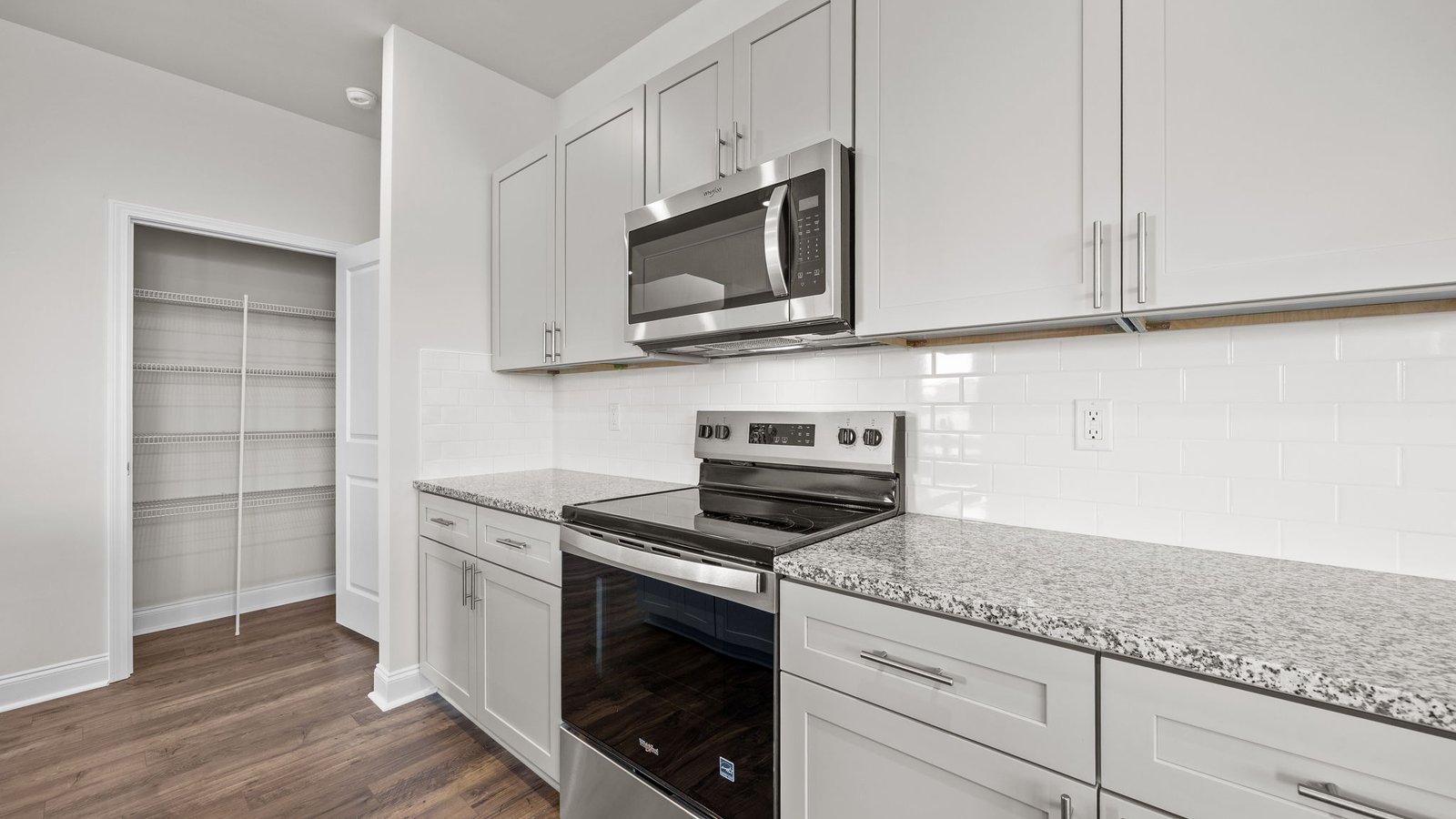 kitchen with stainless steel appliances and shaker cabinets