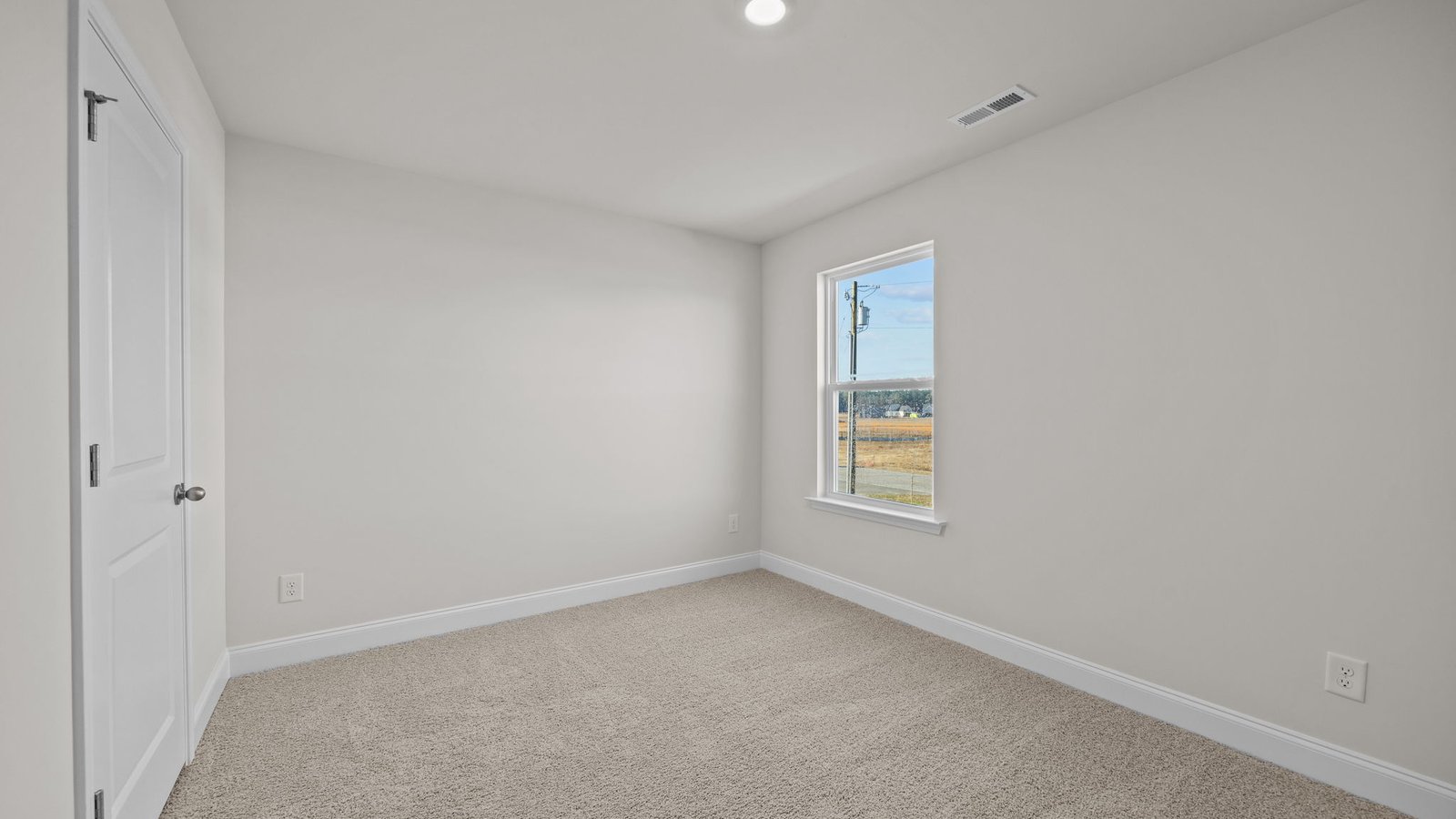 Bedroom with carpet flooring