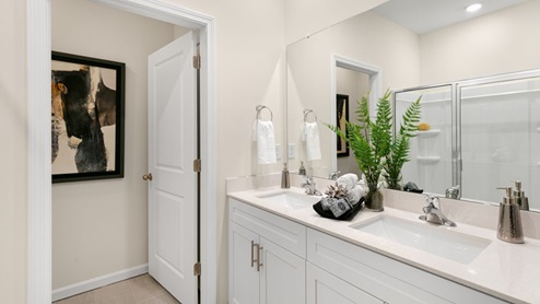 Booth Primary Bathroom with white countertops