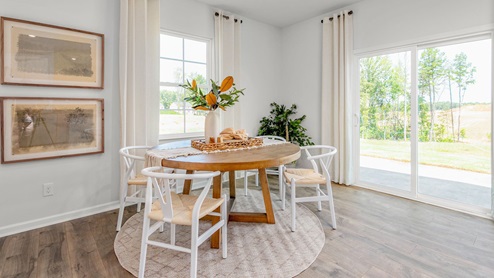 Dining area with large windows.