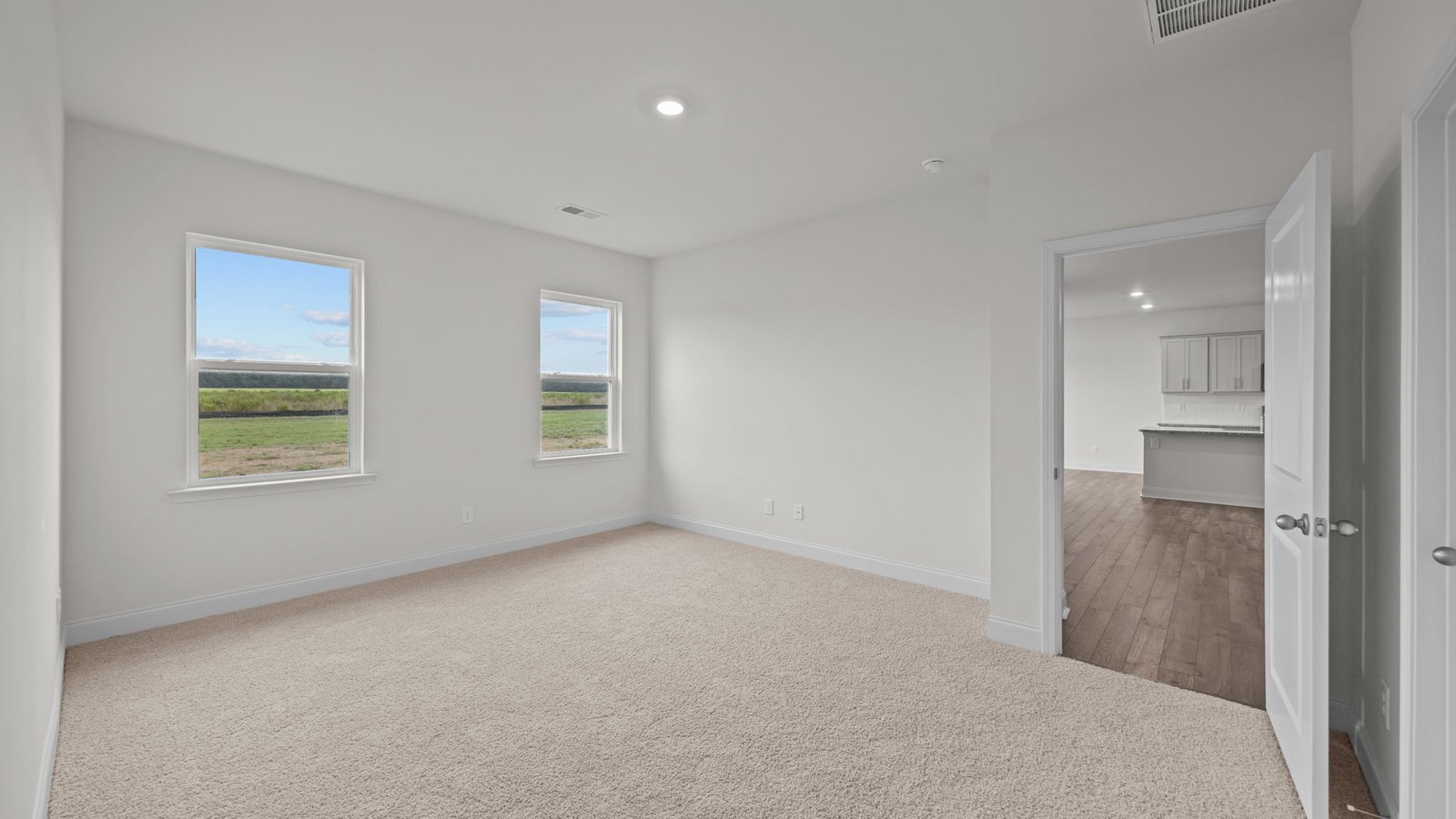 bedroom view with windows
