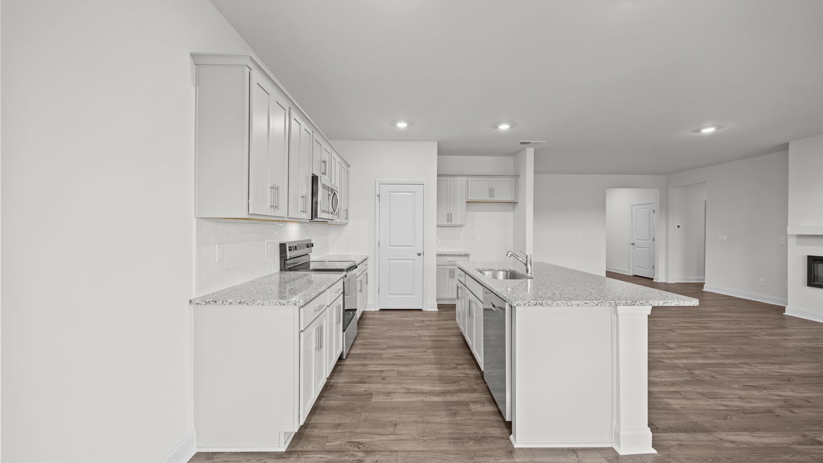 Dining and kitchen area with island and stainless steel appliances
