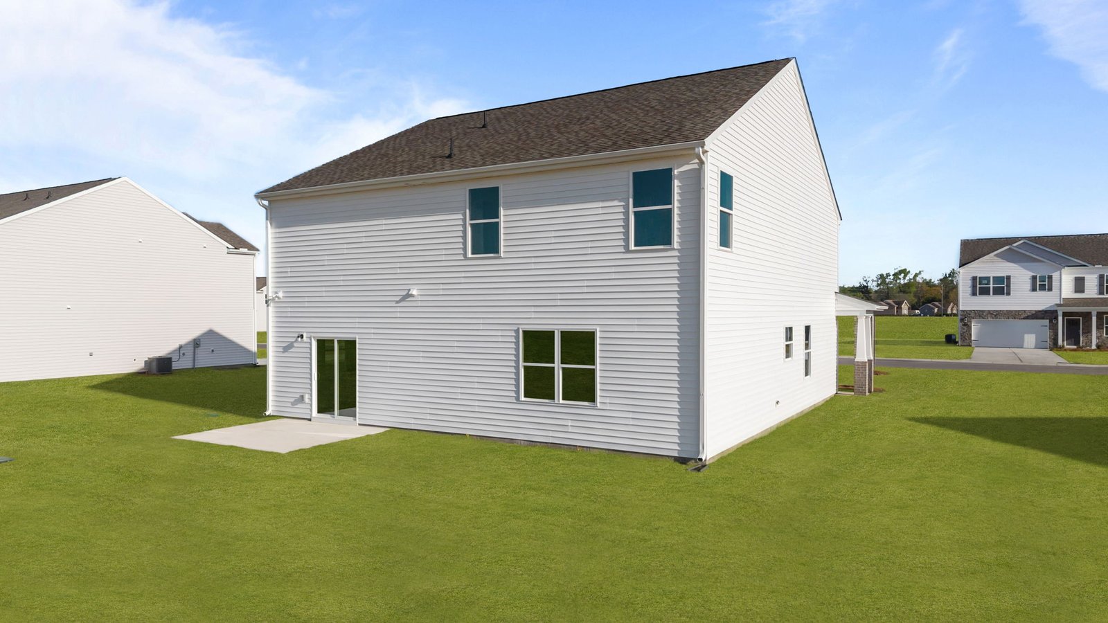 rear view of home with back patio pad