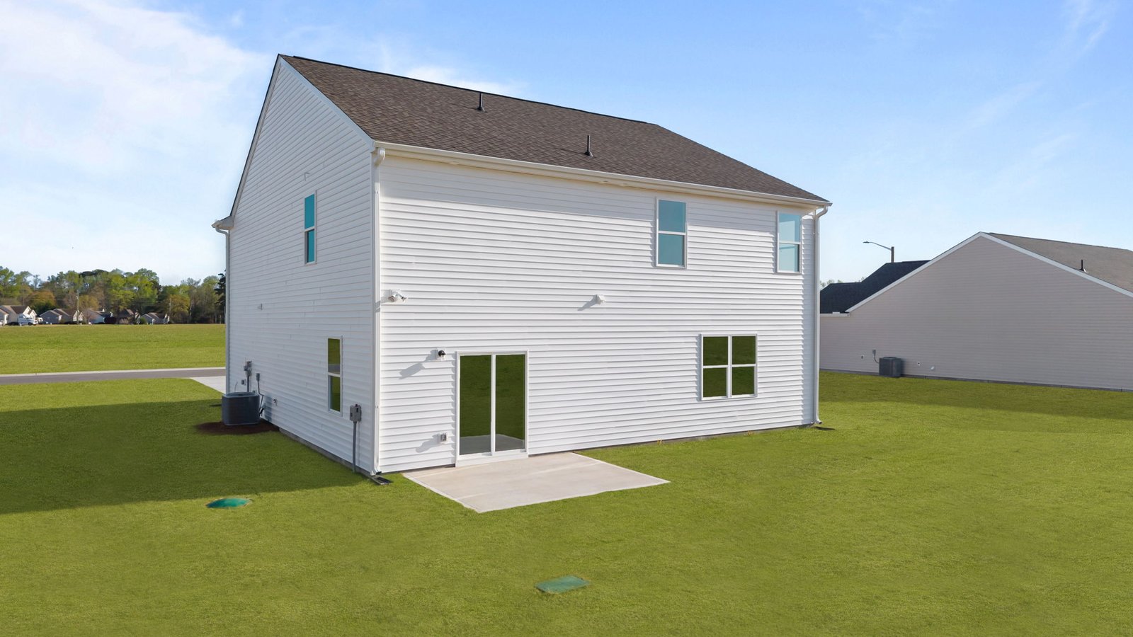 rear view of home with back patio and back yard view