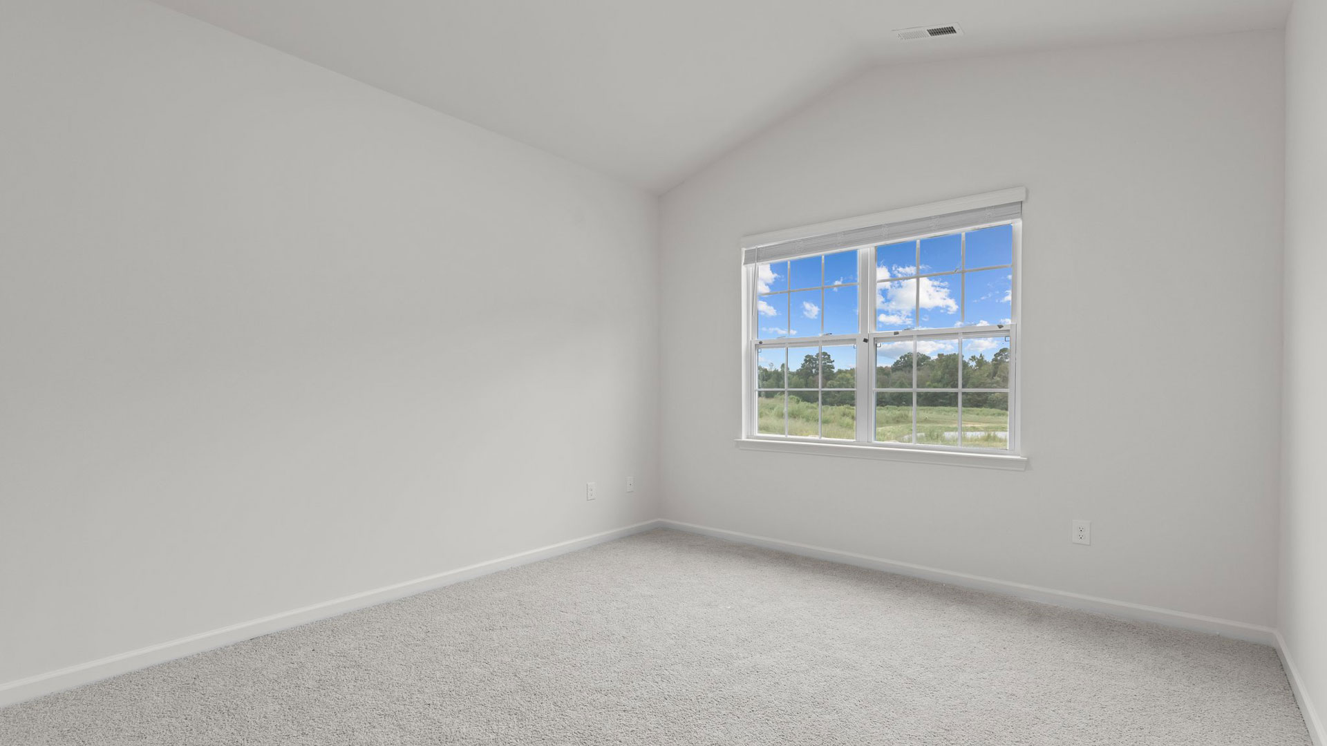 carpeted primary bedroom