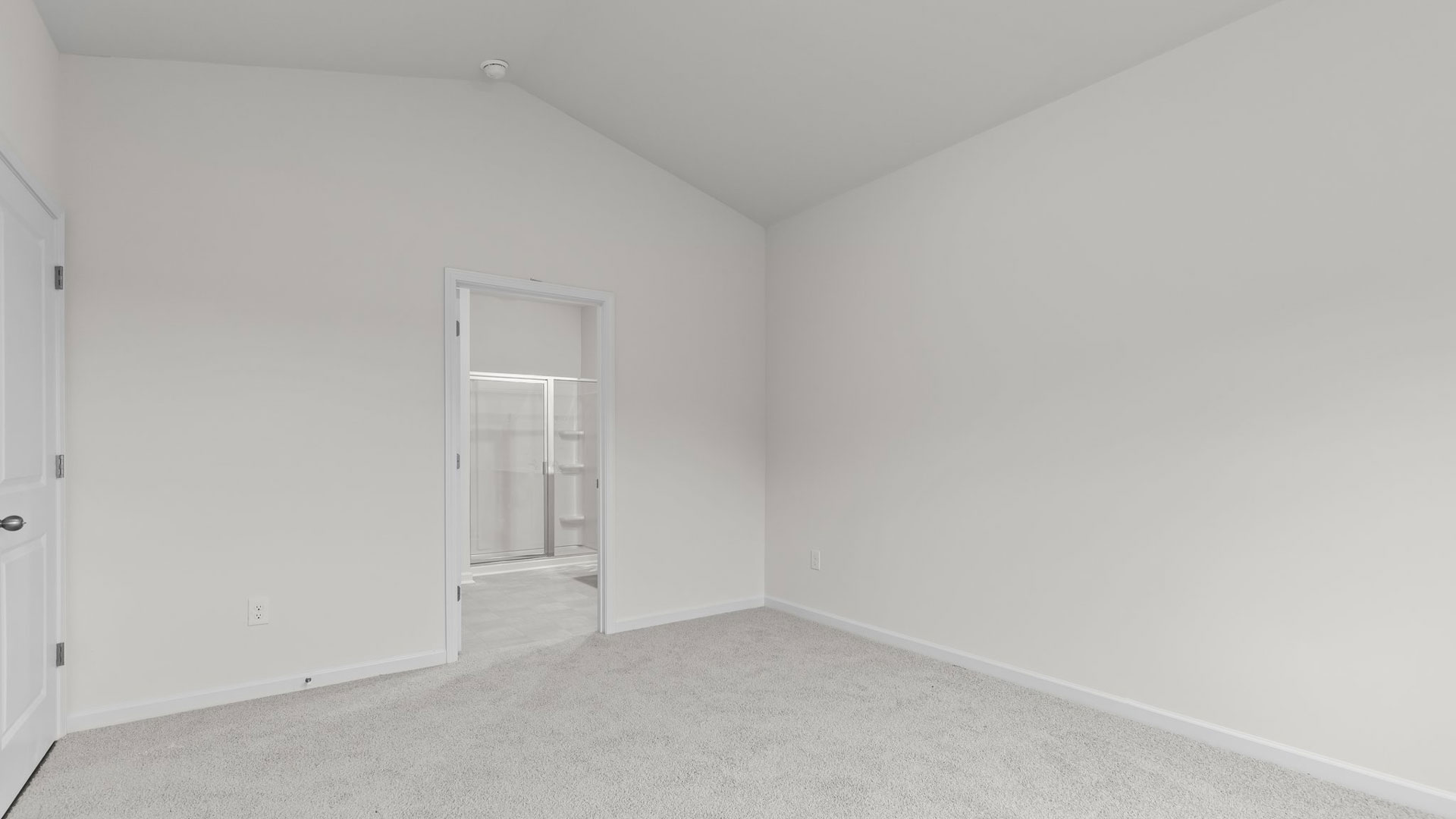carpeted primary bedroom