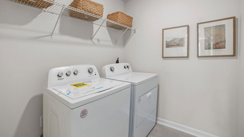 laundry room with built in wire shelving