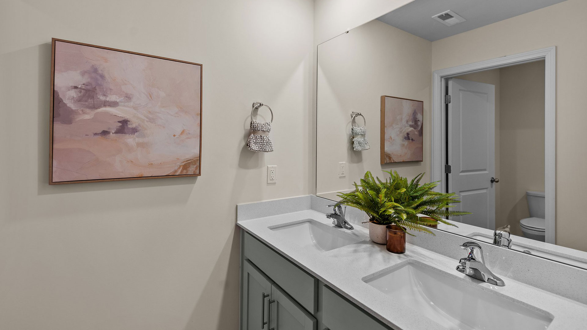 secondary bathroom with double vanity