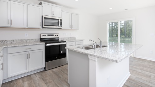 Kitchen with granite counters and stainless steel appliances