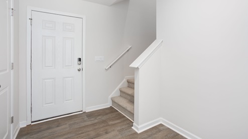 Foyer with white door