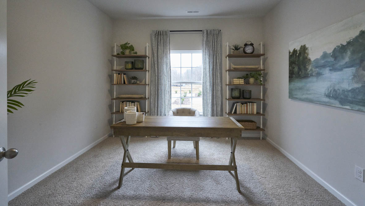 Formal study next to the entrance of the home