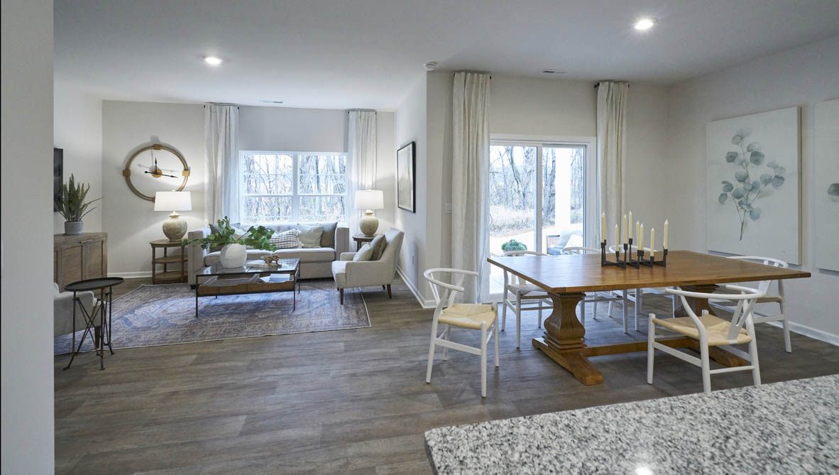 kitchen with light grey cabinetry, large island and stainless steel appliances