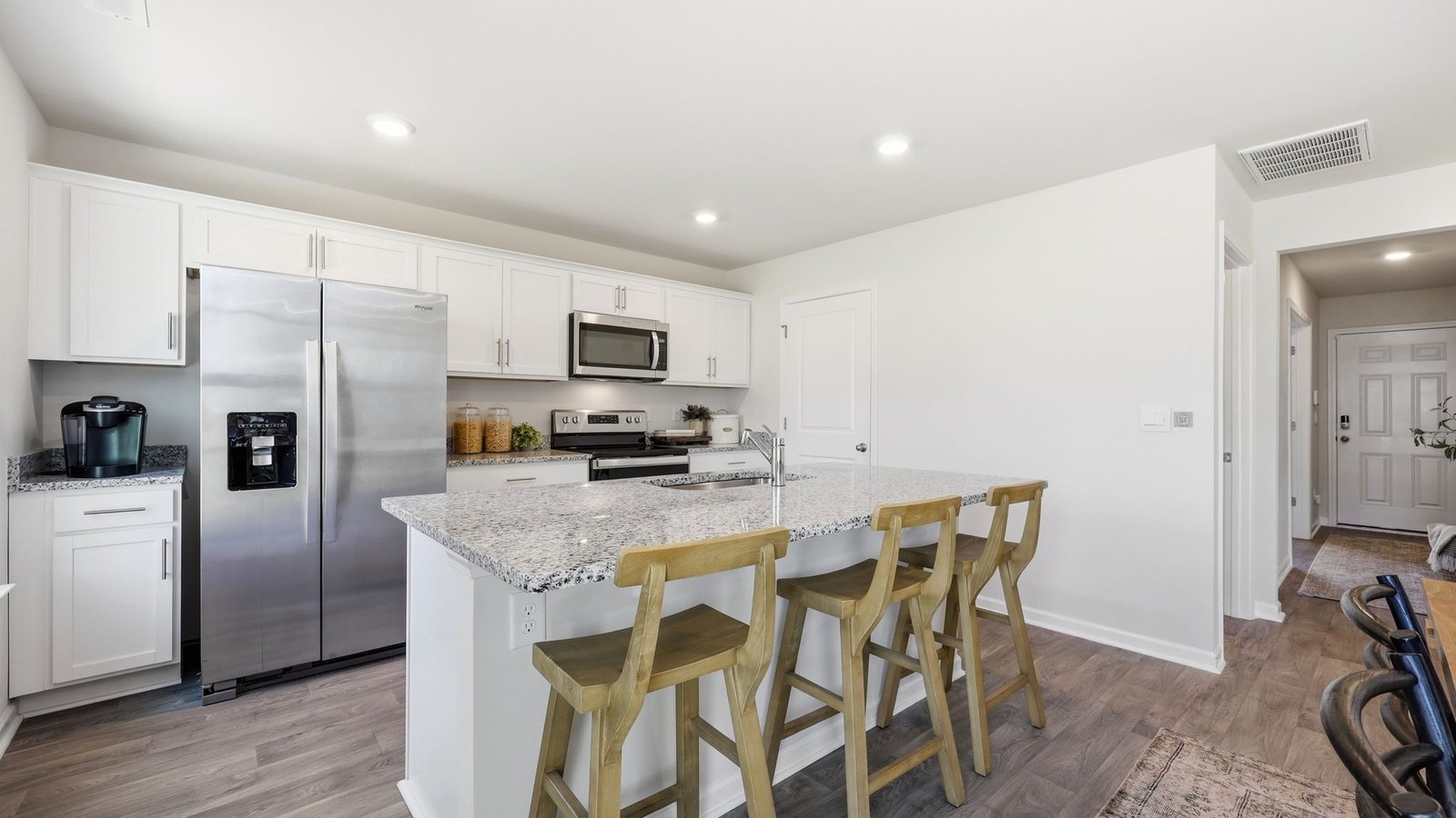 kitchen peninsula with barstools open concept
