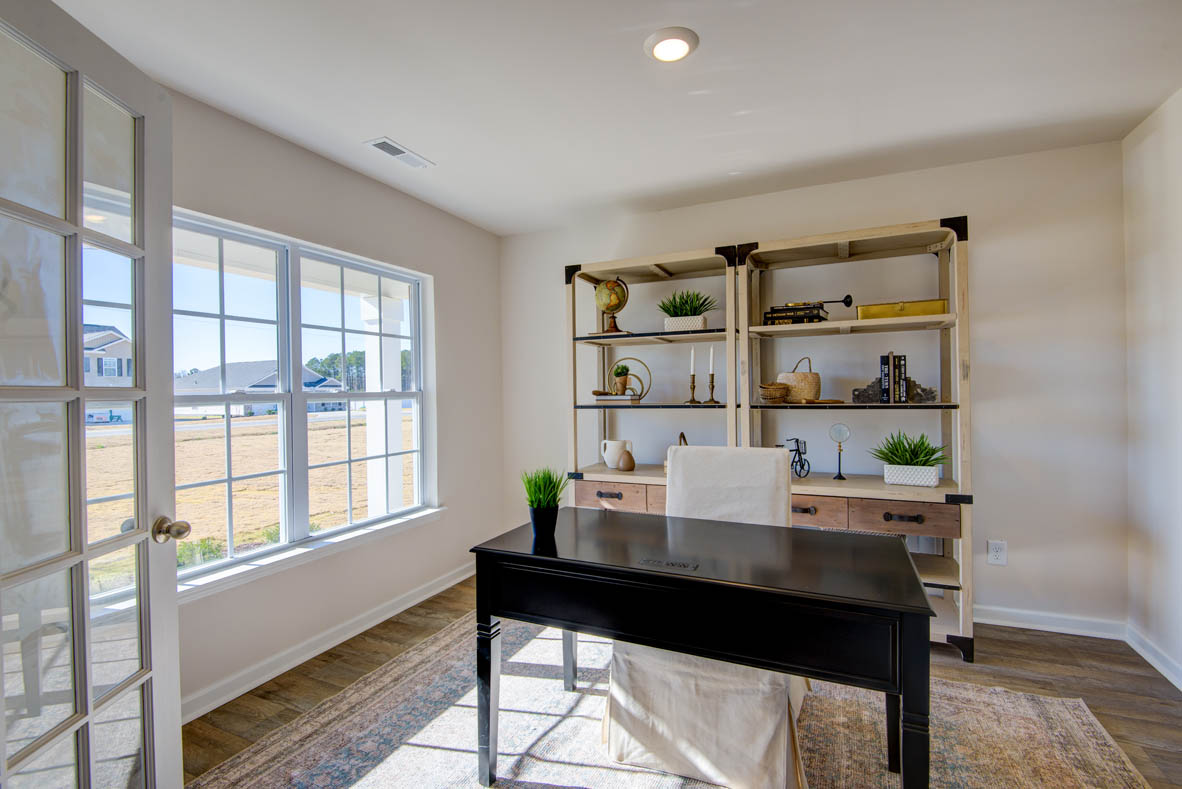 Formal study next to the entrance of the home