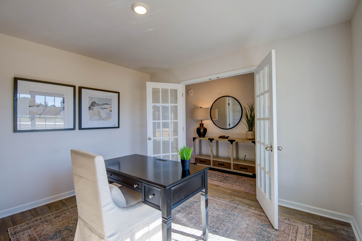 Formal study next to the entrance of the home