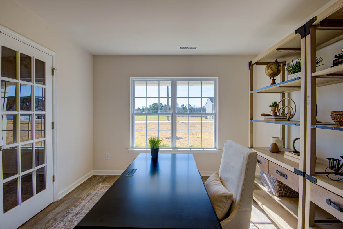 Formal study next to the entrance of the home