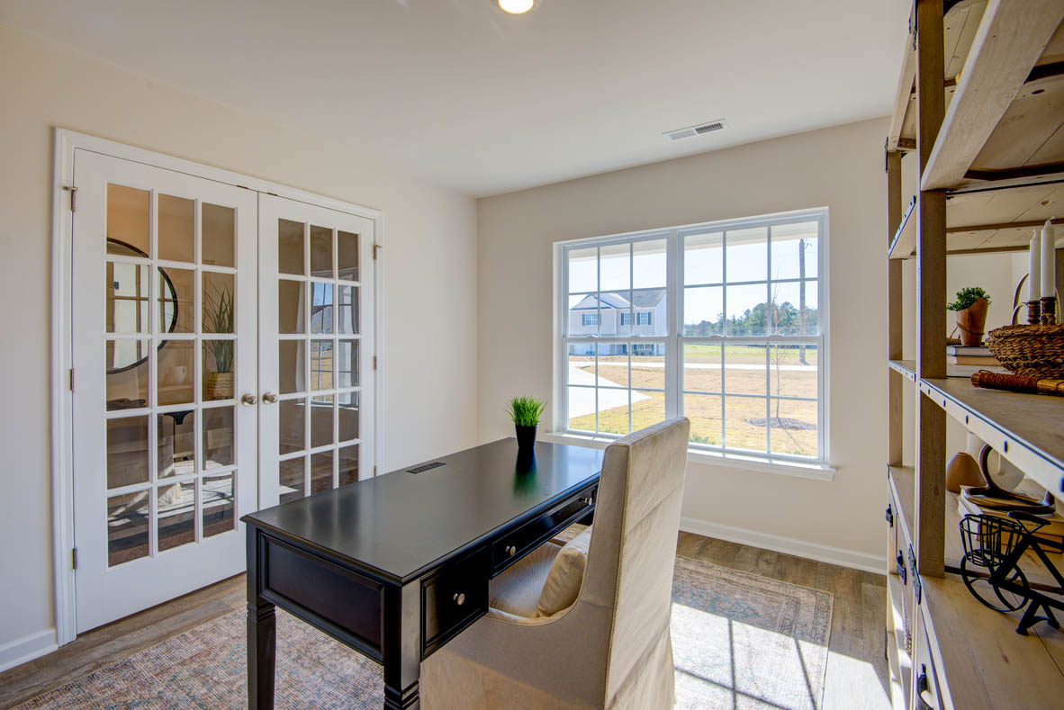 Formal study next to the entrance of the home