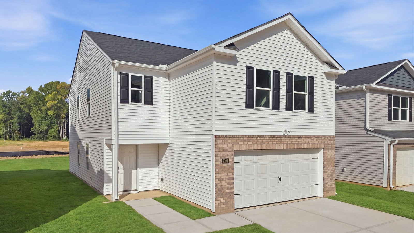 front view of two story home with two car garage