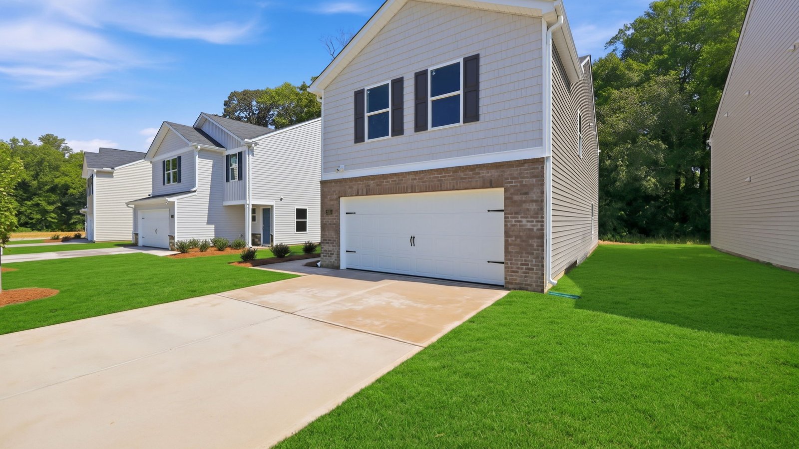 front view of two story home with two car garage