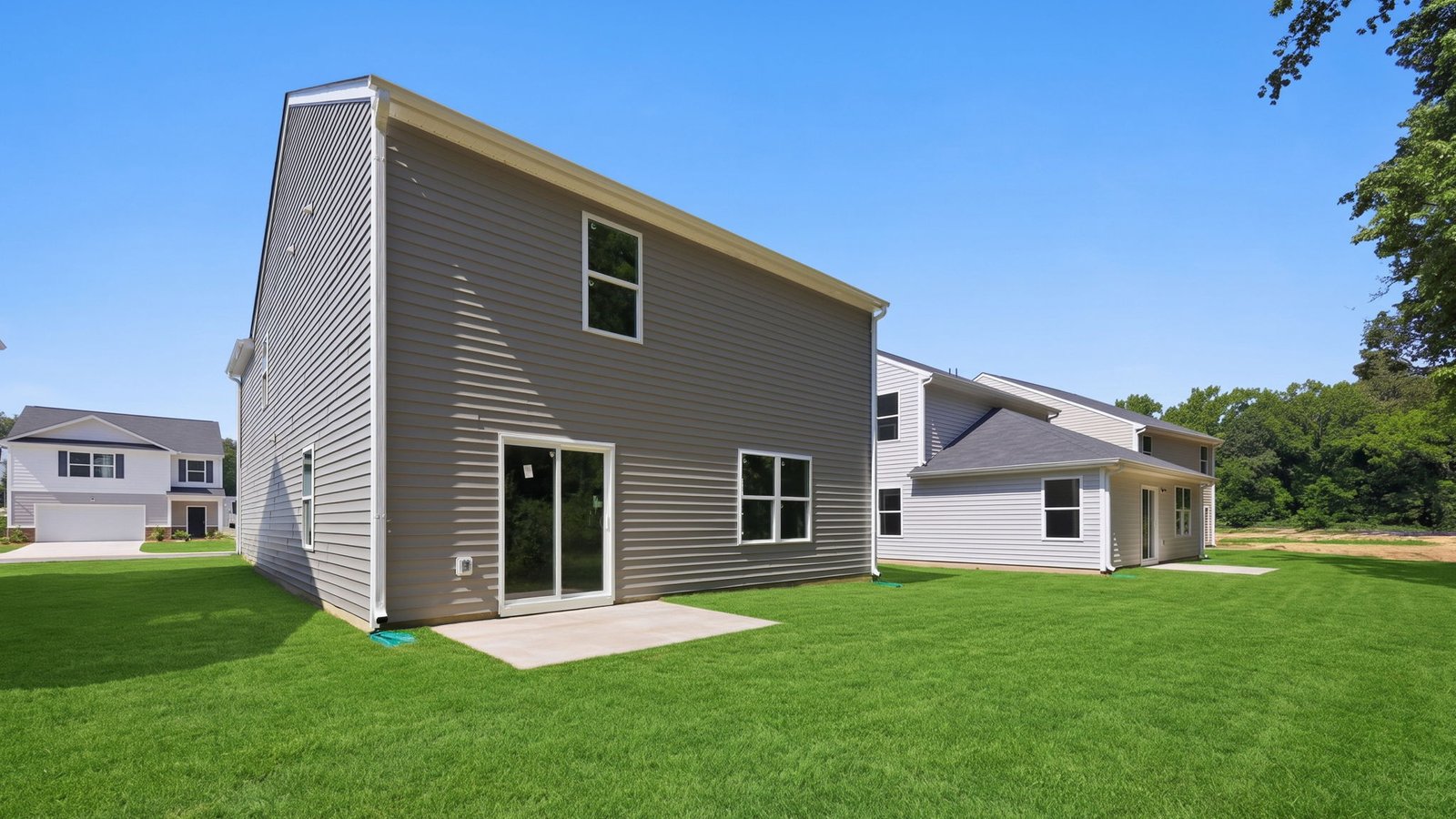 rear view of back yard with back patio pad