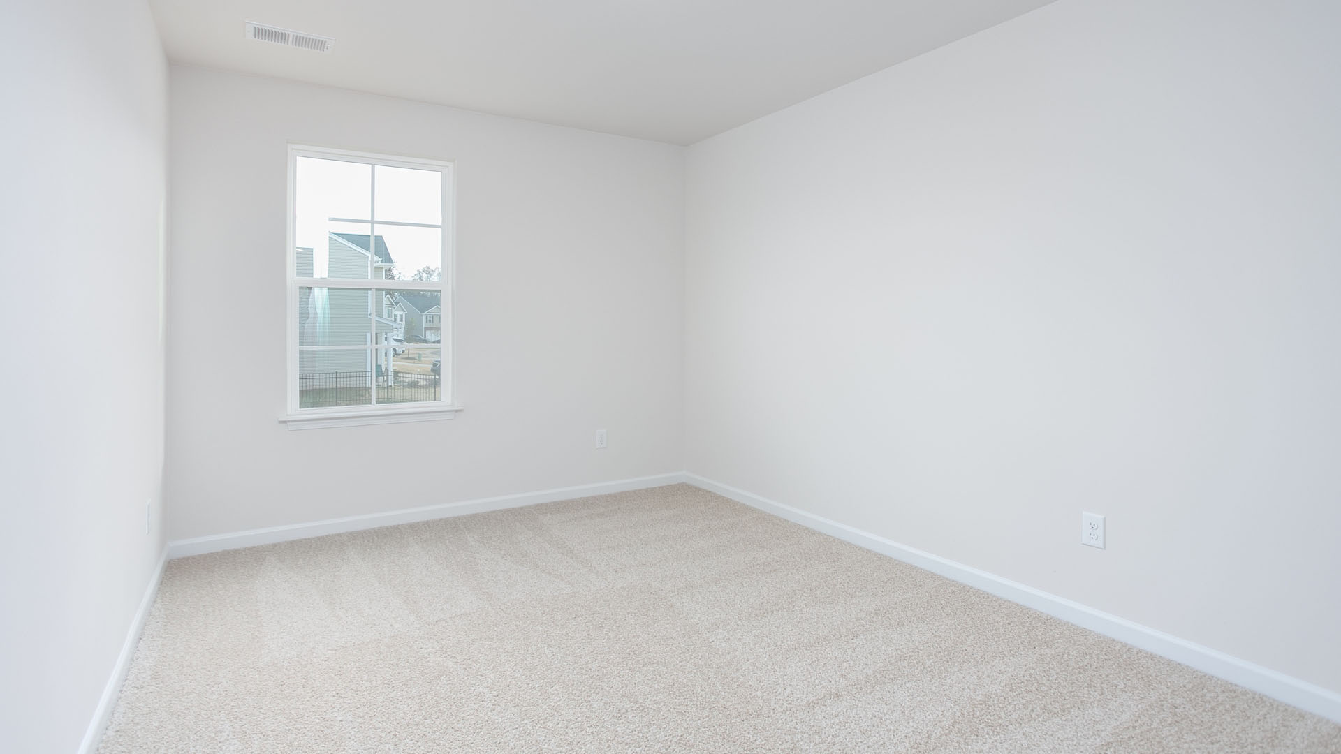 bedroom view with window