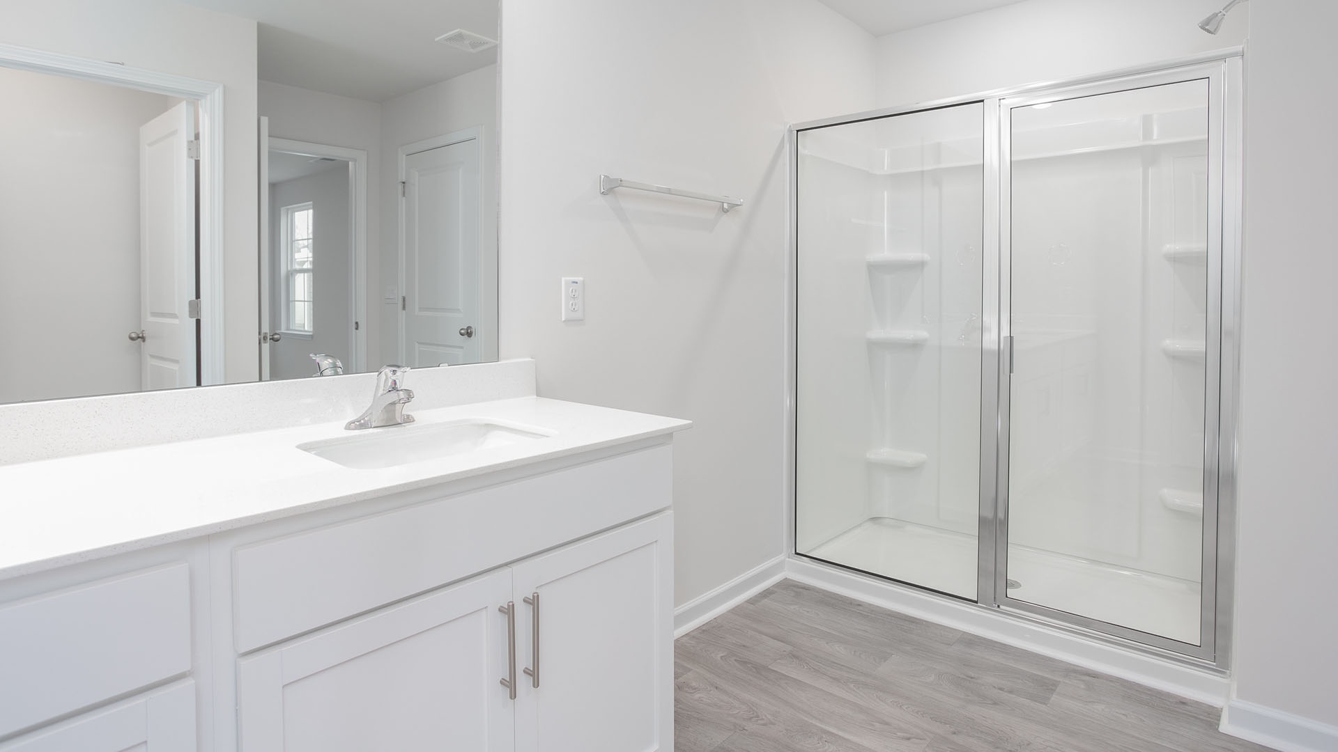 bathroom with white cabinets