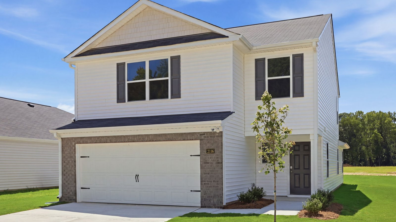 front of two story home with two car garage