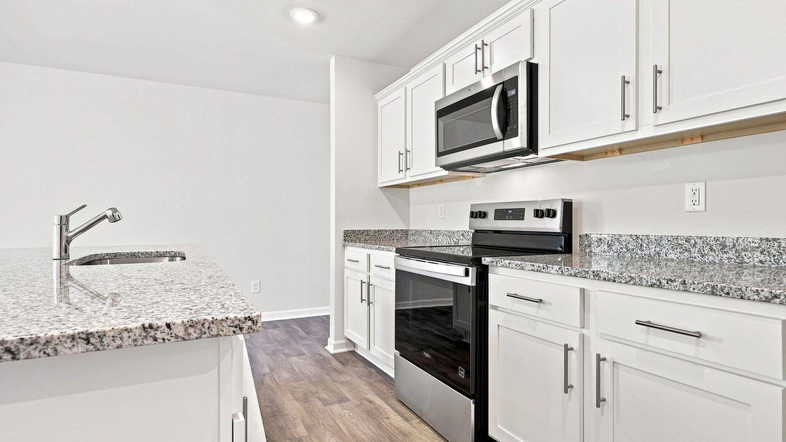 kitchen area with stainless steel appliances and kitchen island