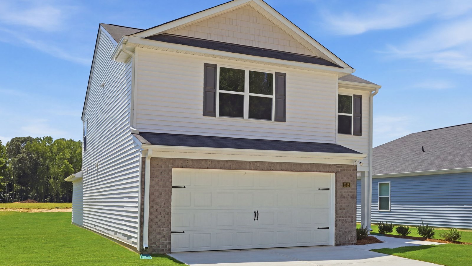 front of two story home with two car garage