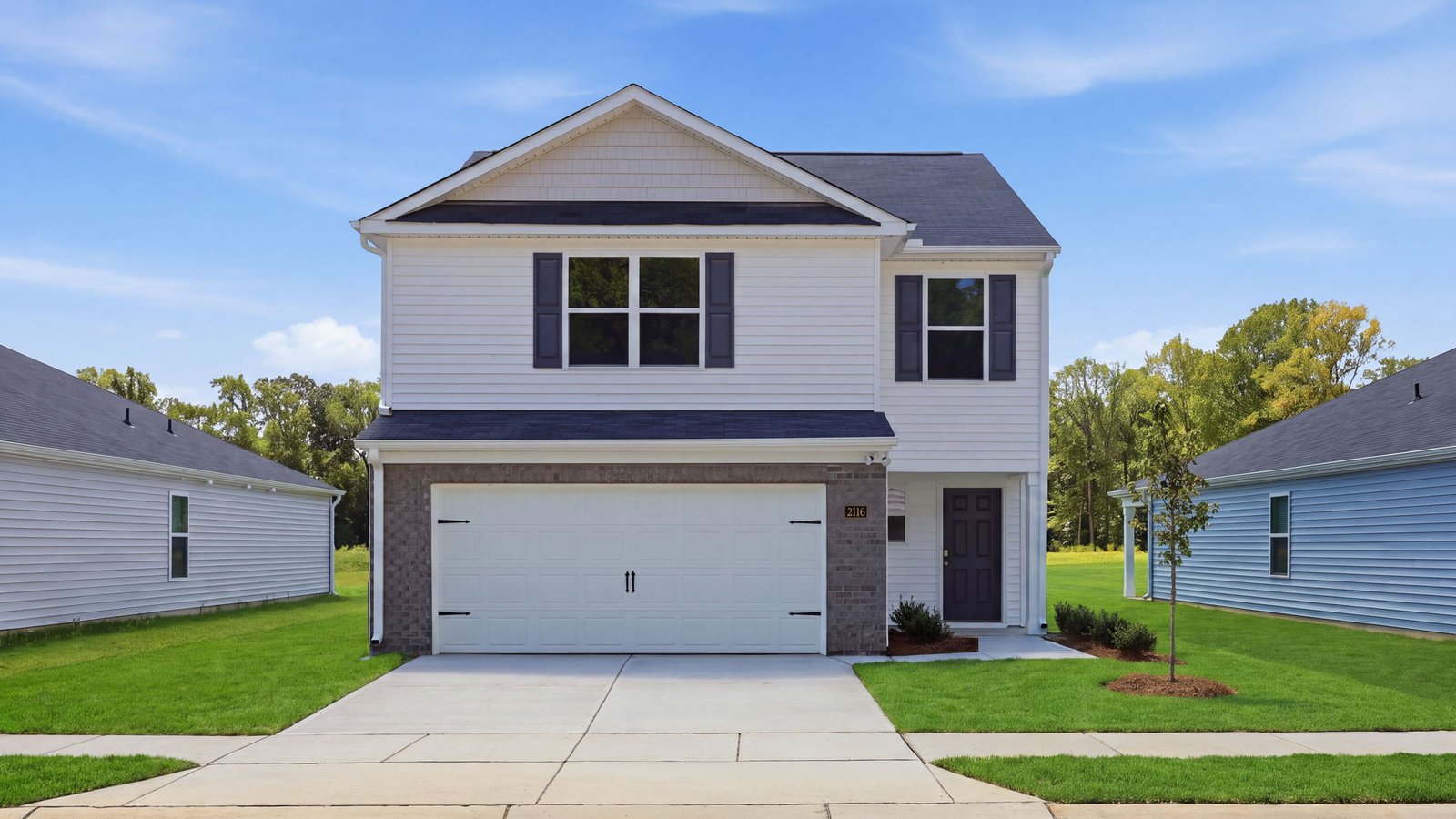 front of two story home with two car garage