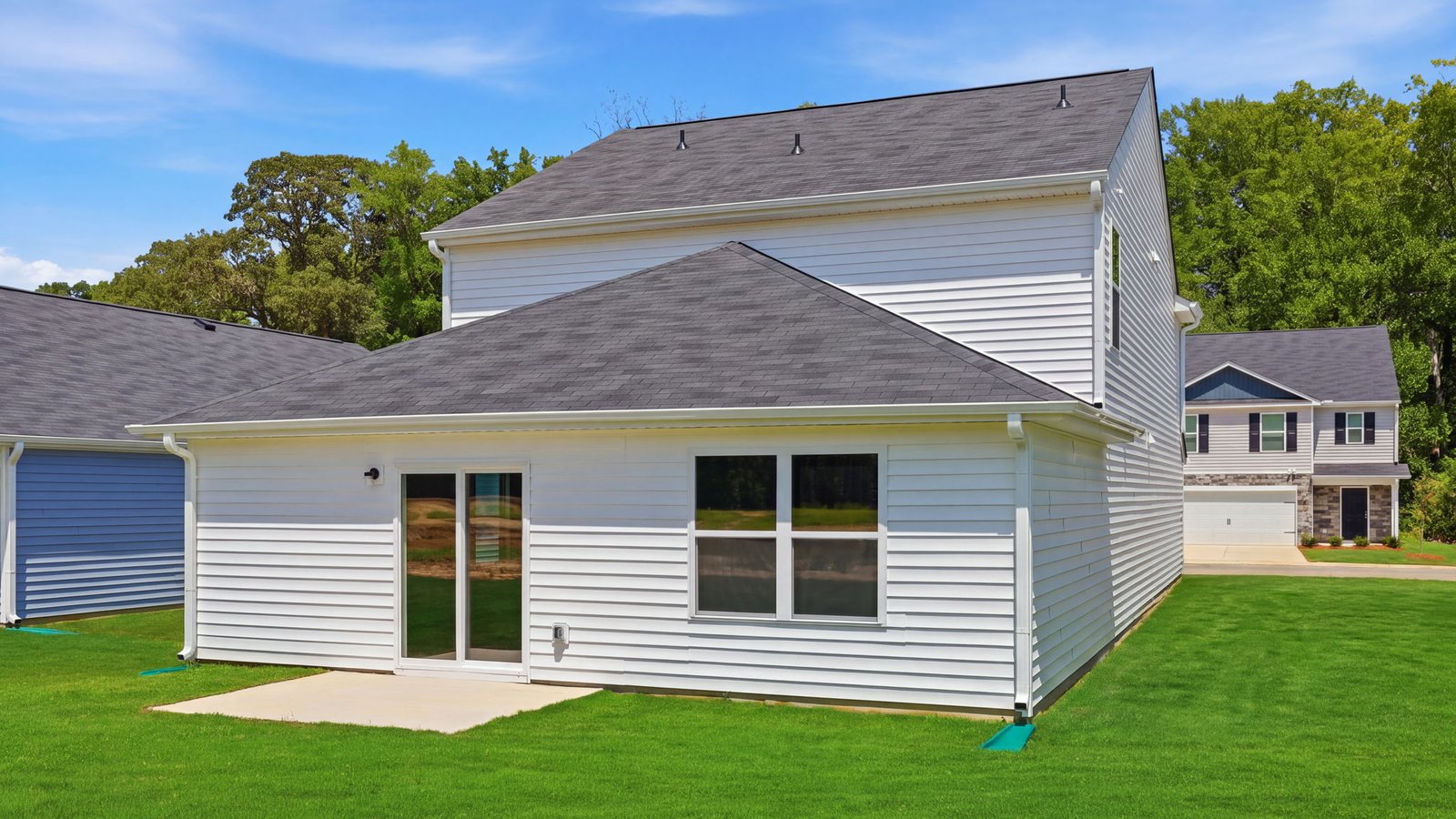 rear view of home and back patio pad