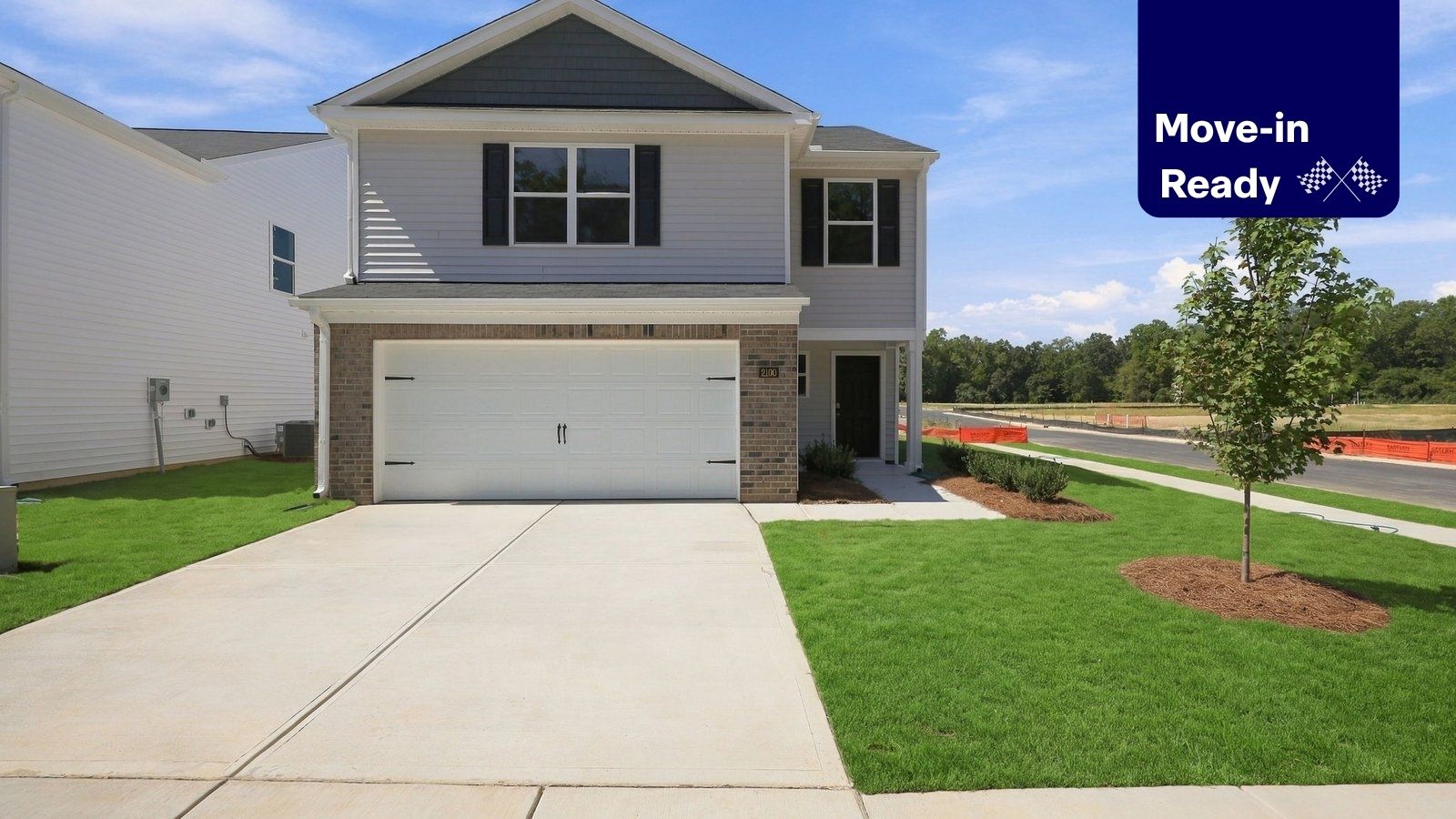 front of two story home with two car garage