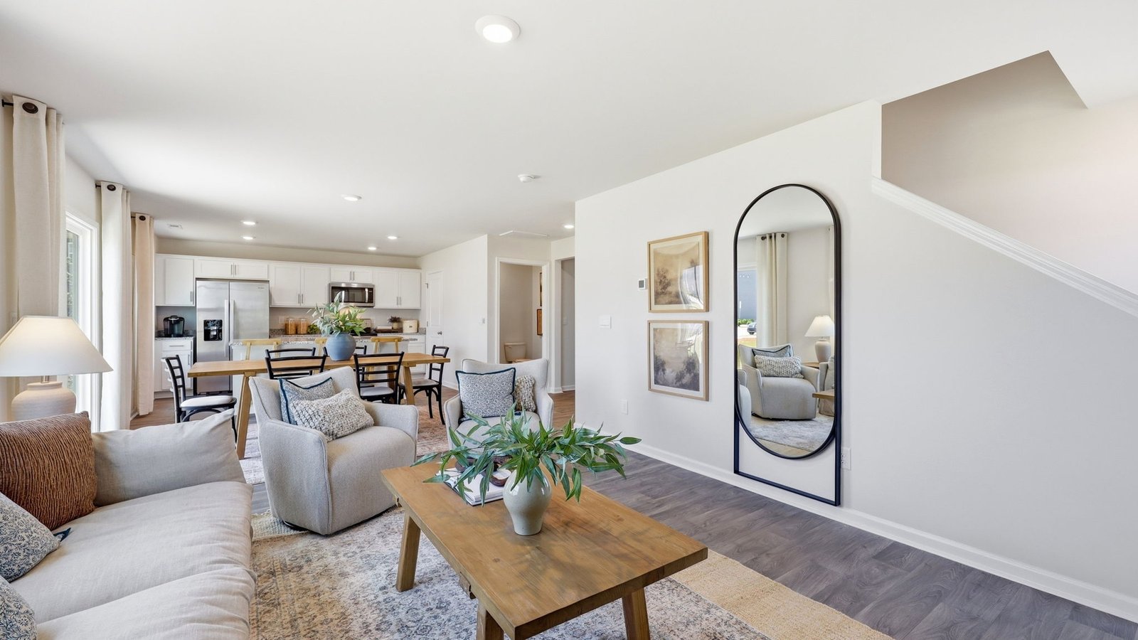 living area with view of dining and kitchen