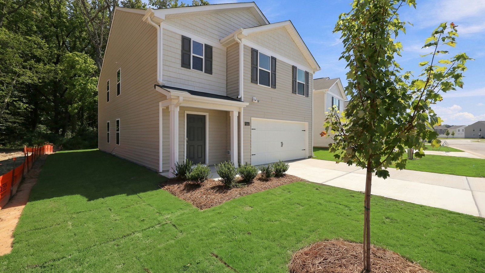 front of the two story home with two car garage