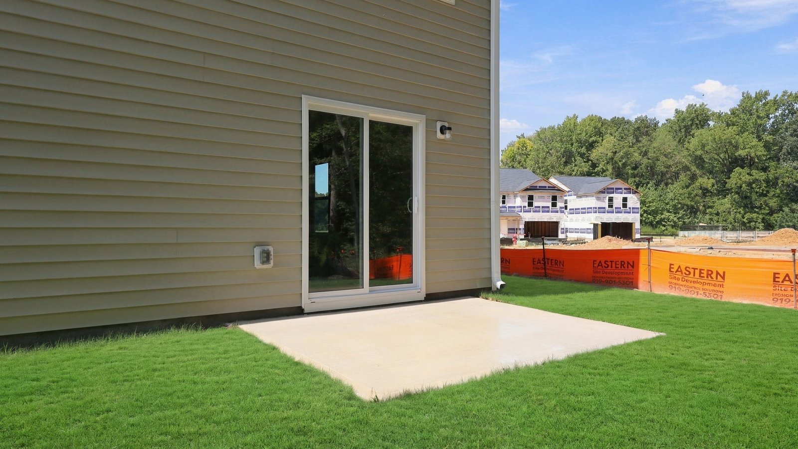 rear view of the back yard and back patio pad