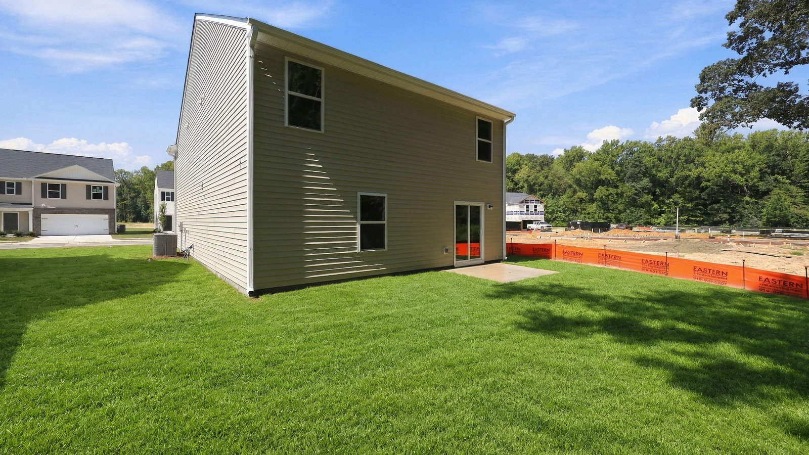 rear view of the back of the home and lot
