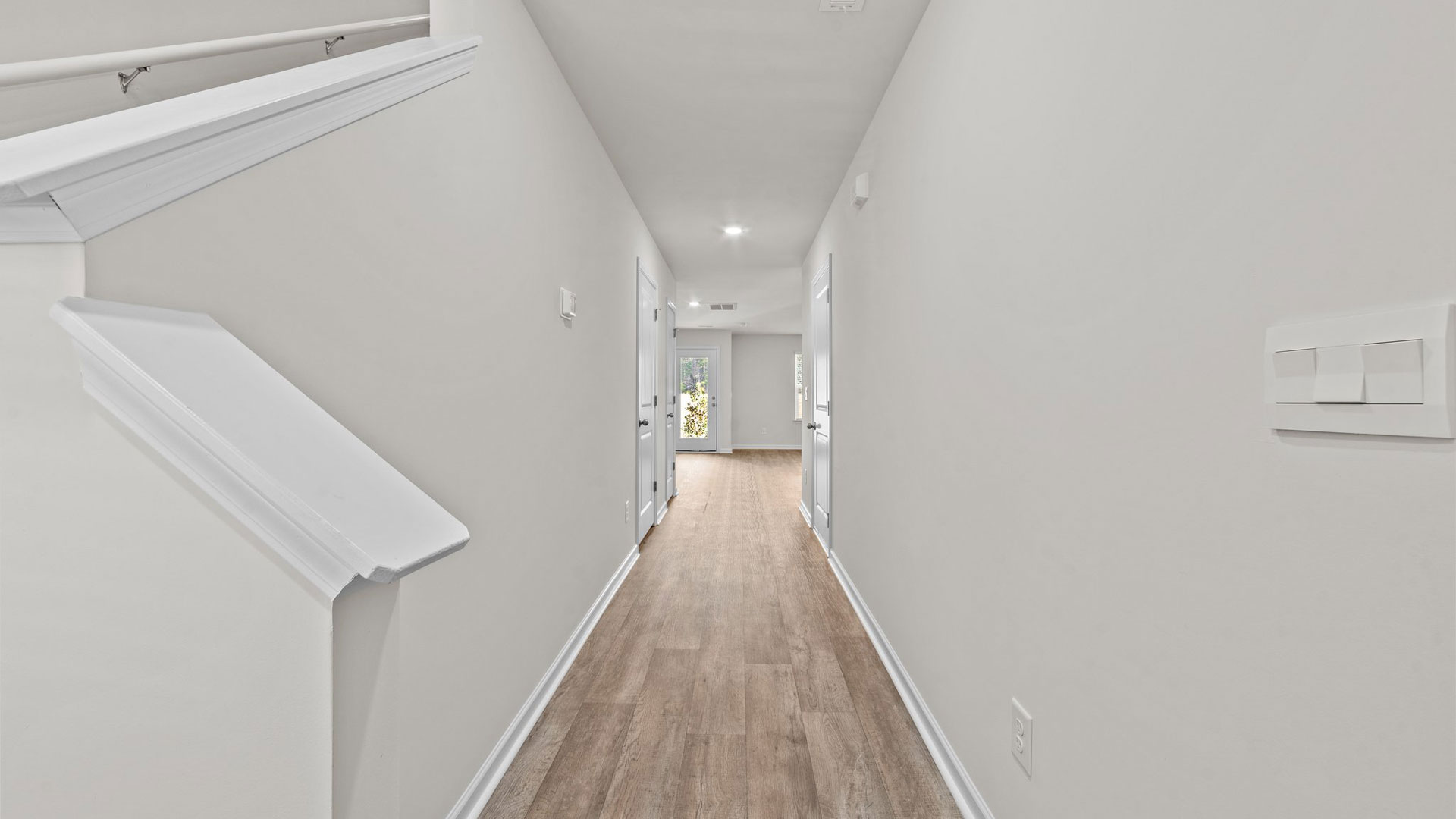 hallway with revwood flooring