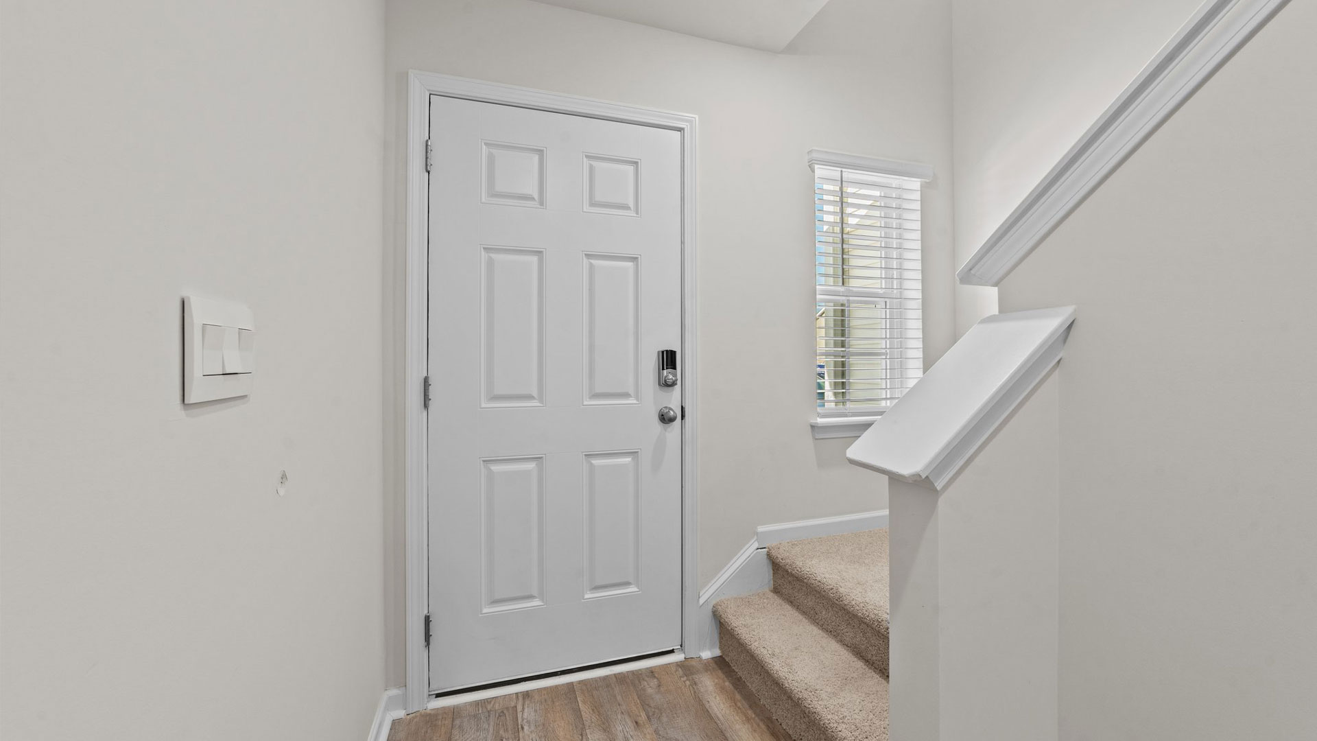 entryway with white door