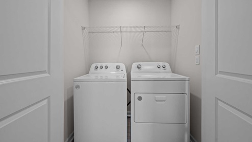 laundry closet with wire shelving