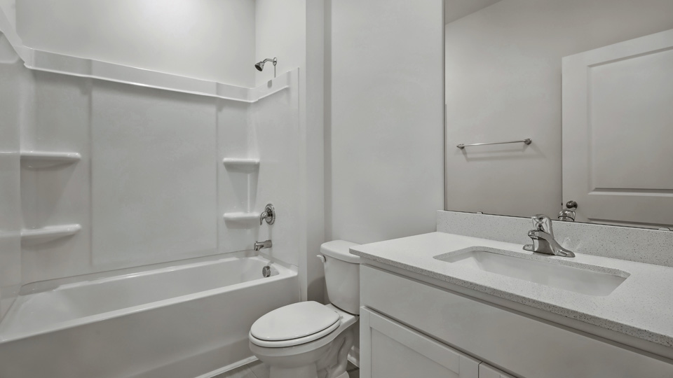 Bathroom with white cabinets