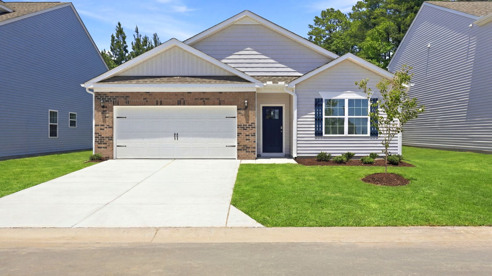 vinyl and brick one story home with attached garage