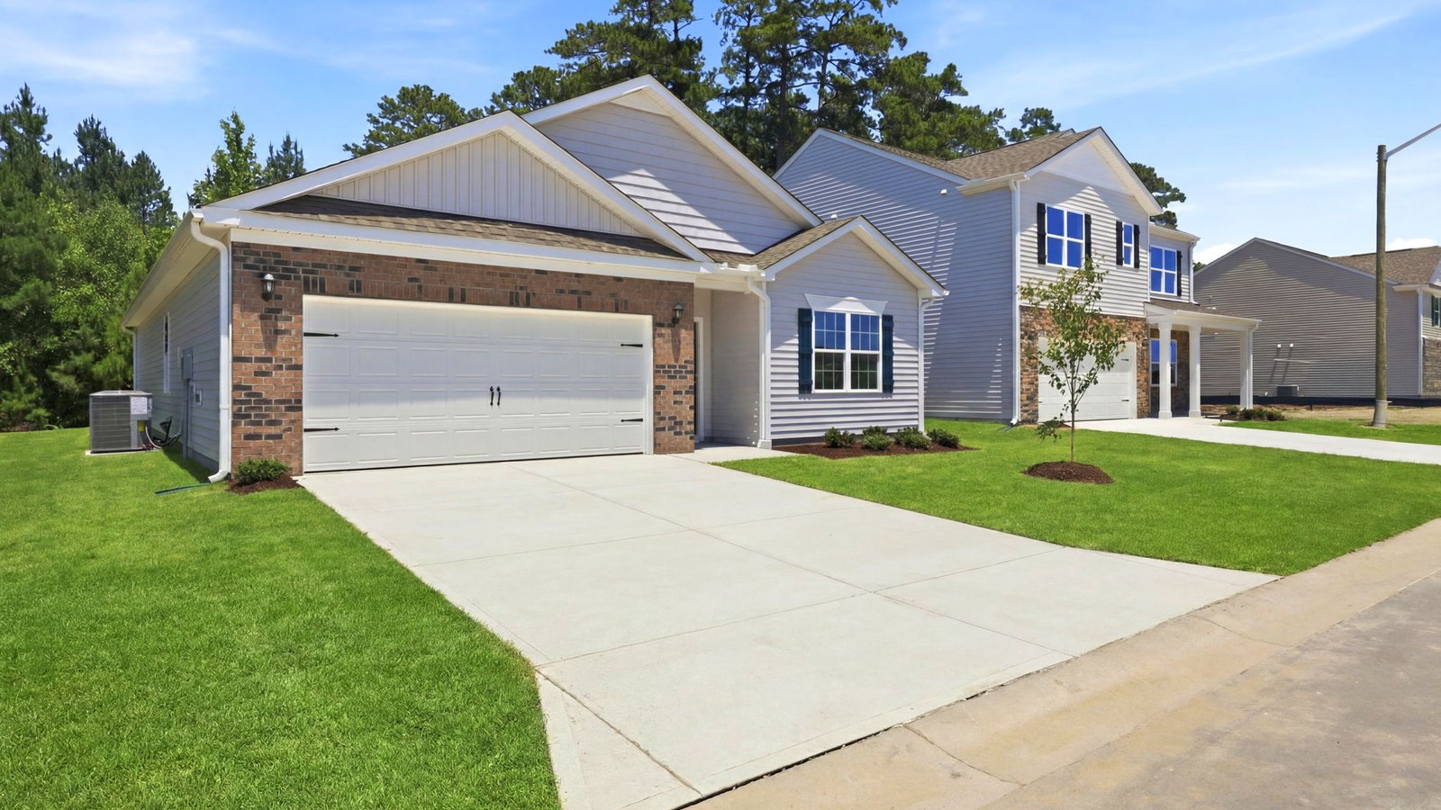 exterior photo of ranch style home with vinyl and brick