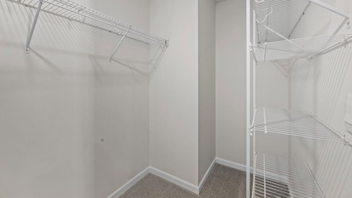Walk in closet with built in wire shelving