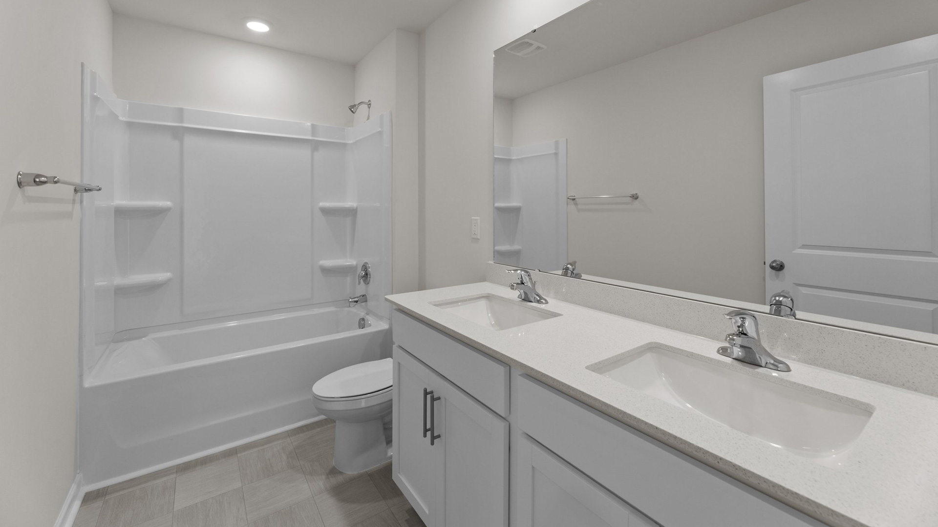 Bathroom with double sinks and quartz counters