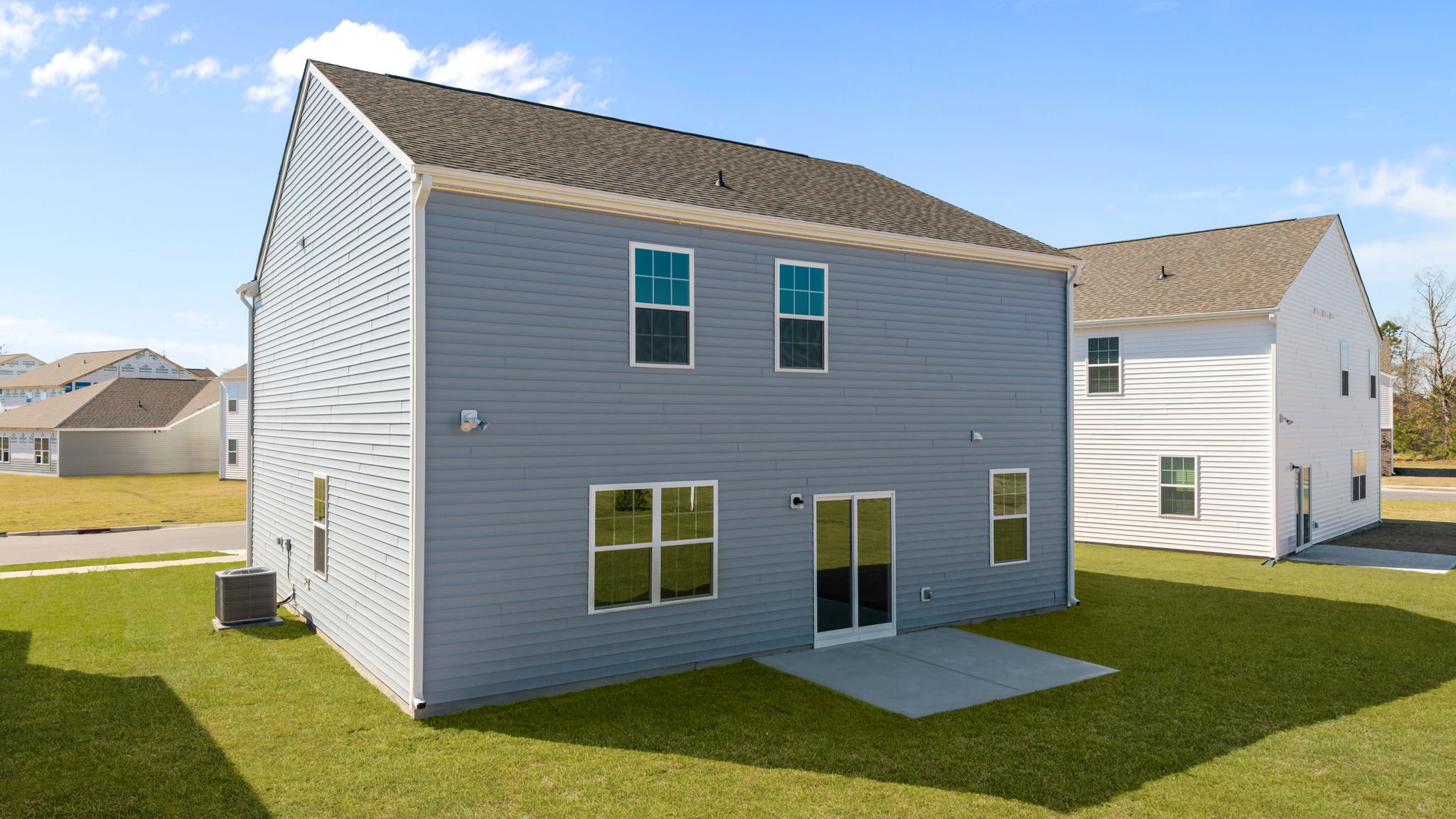 Back view of the home and yard