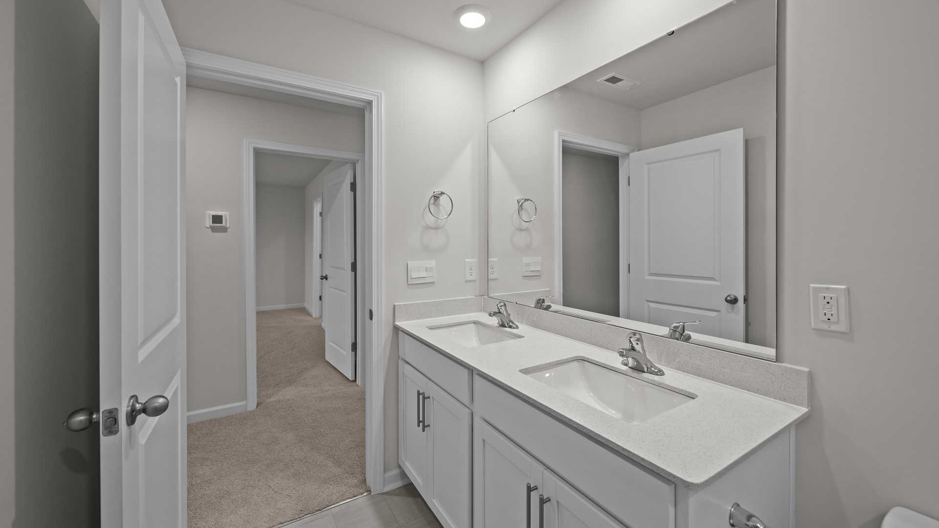 Bathroom with white cabinets