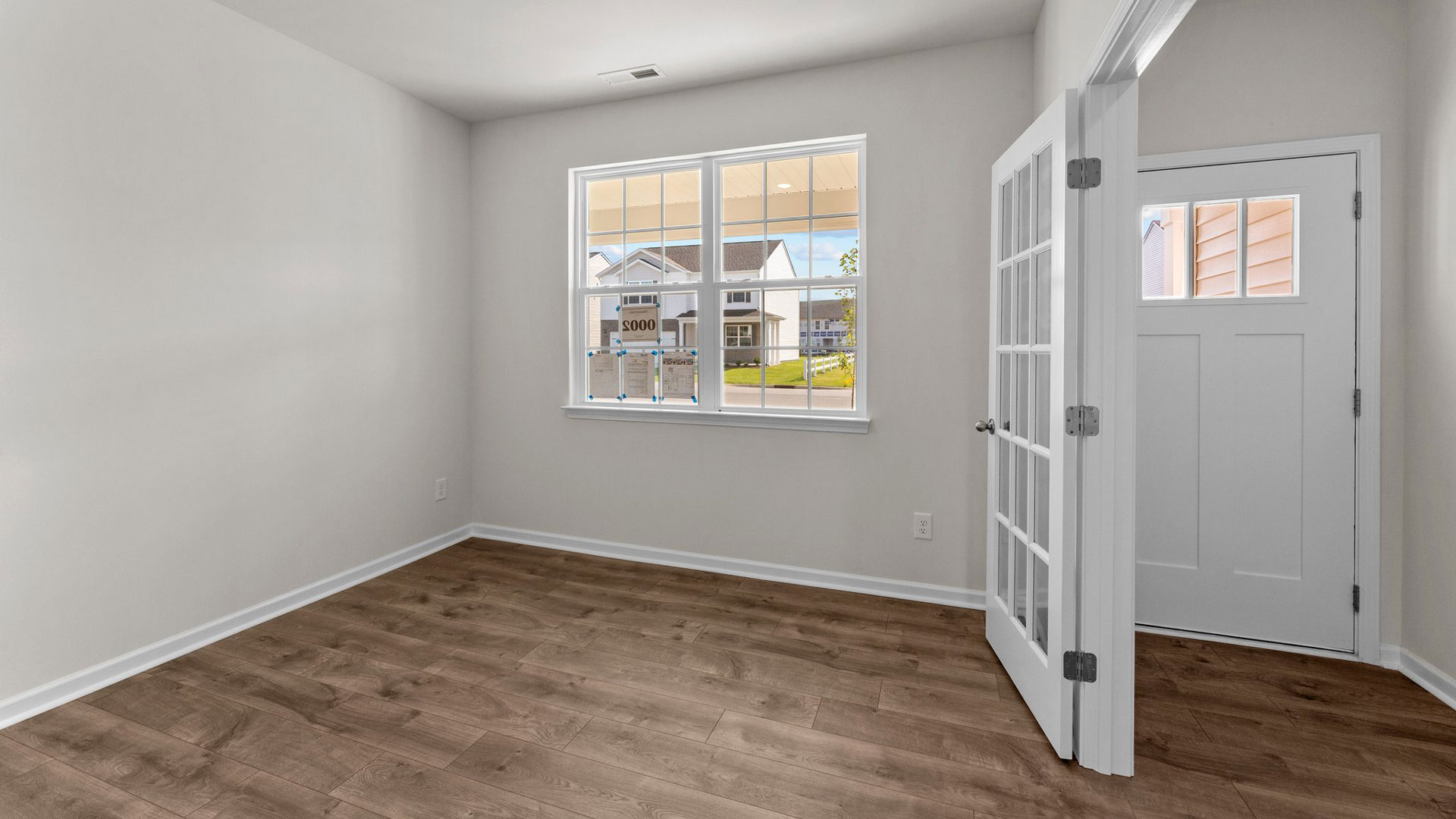 Formal study next to the entrance of the home