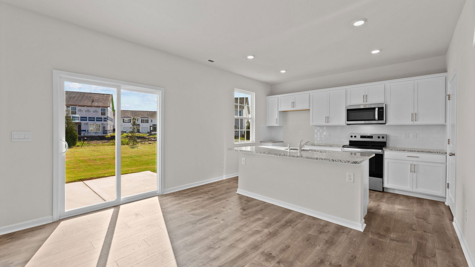 living and dining space with kitchen view