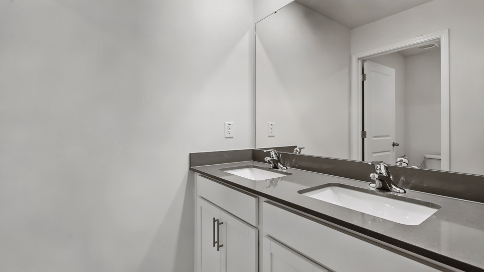 Bathroom with white cabinets
